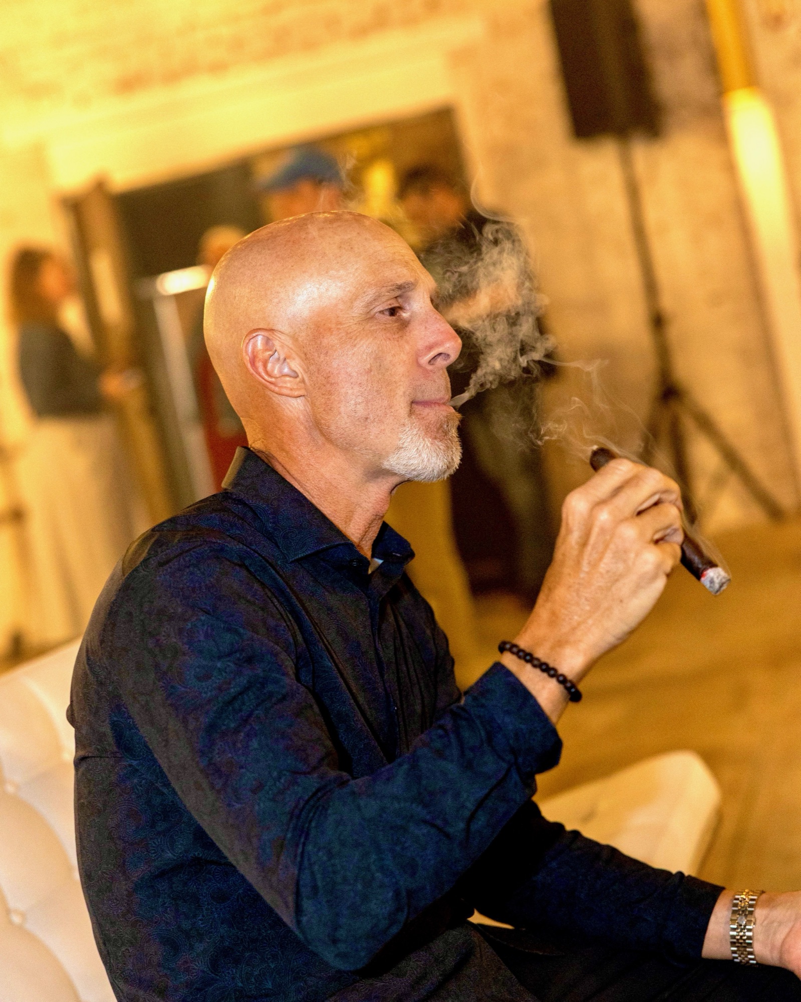 A guest enjoying a cigar at last year's Smoke Affair Social