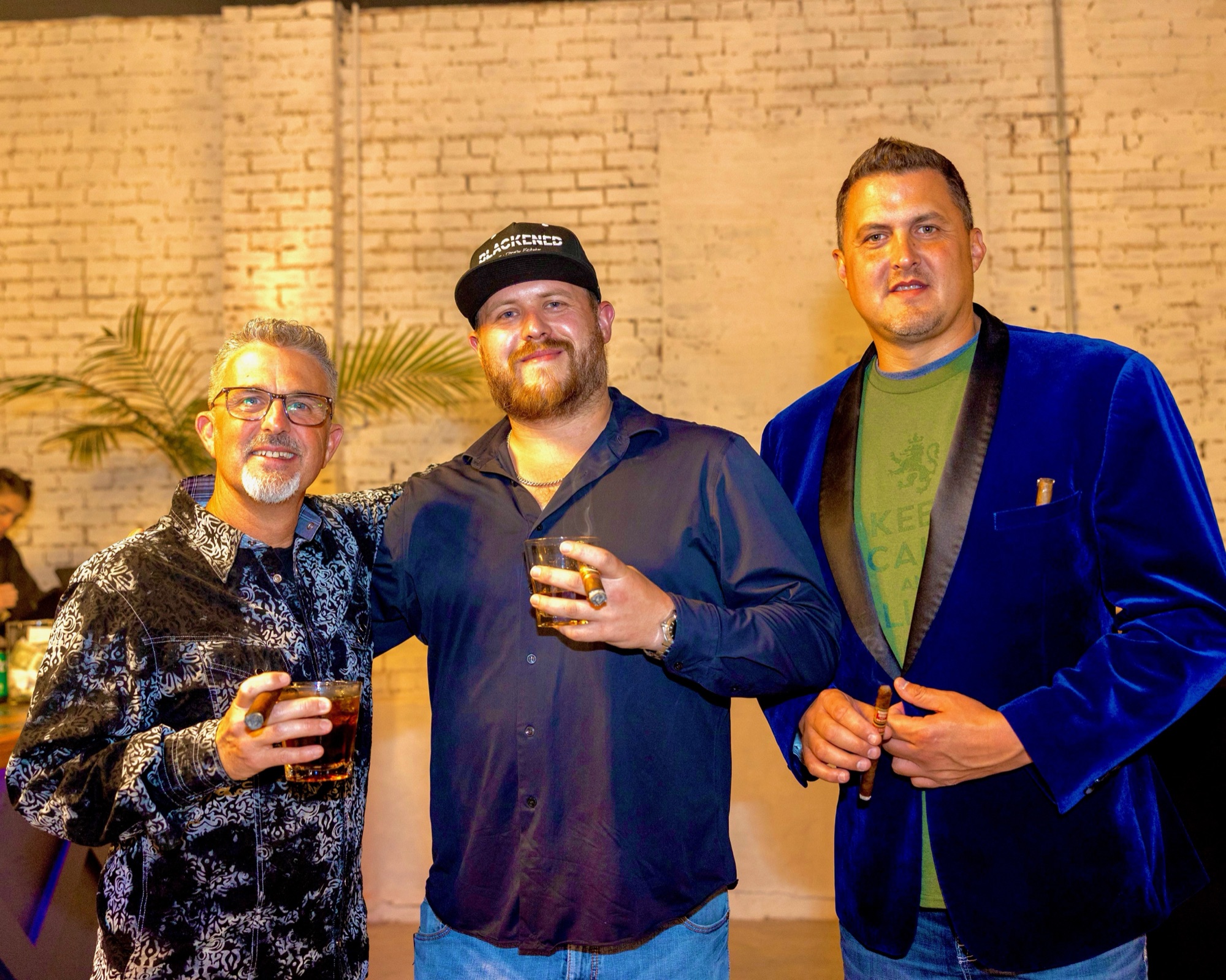 Three friends with whiskey and cigars at last year's Smoke Affair Social